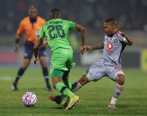 Christopher Sithole of Marumo Gallants challenged by Oswin Appollis